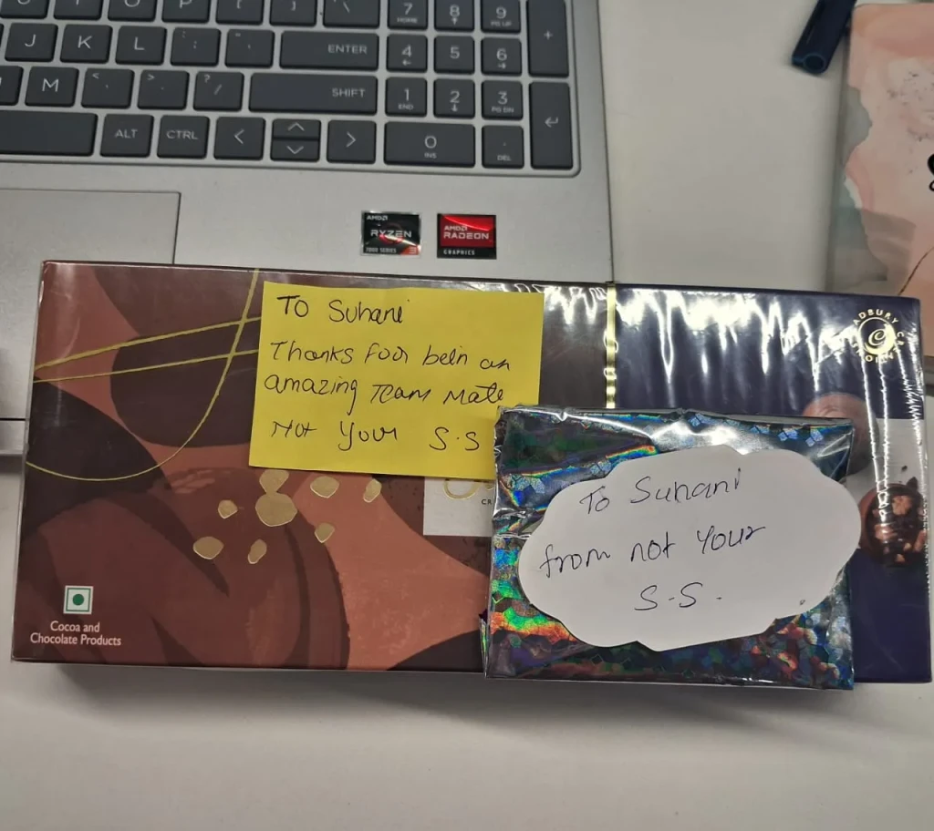 Secret Santa gifts with handwritten notes for a teammate